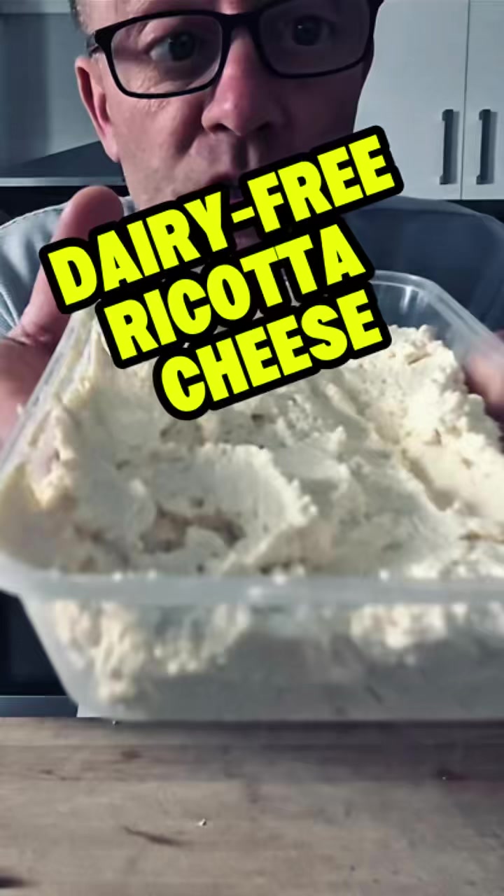 Dairy-Free Ricotta Cheese

This one’s a ripper — creamy, tangy, and completely dairy-free.

Ingredients:
• 4½ cups good-quality soy milk
• 4 tbsp lemon juice or 2 tbsp apple cider vinegar
• 1 tsp salt (plus a good pinch more for seasoning)
• 1 tbsp nutritional yeast
• 1 tbsp lemon juice (extra, for mixing in at the end)
• A good splash of olive oil

Optional add-ins: garlic powder, fresh or dried herbs, cracked pepper

⸻

Method:
Start by grabbing a large saucepan and pour in your soy milk. Bring it up to the boil, then turn off the heat.

Add your salt and either the apple cider vinegar or lemon juice. Give it a good stir, then let it sit for around 15 minutes — that’s when the magic happens, and it’ll start to curdle.

Next, set up a bowl with a strainer lined with cheesecloth. Pour your curdled mixture in and let it drain for about a minute. Then fold the cheesecloth over the top and place something heavy on it — a tin of beans or whatever you’ve got — and leave it for 15–20 minutes until most of the liquid’s drained out.

Keep that leftover buttermilk-style liquid! It’s great for frying or adding to batters.

Once drained, pop your ricotta into a bowl and mix through your extra lemon juice, nutritional yeast, and a splash of olive oil. Taste it — add more salt, herbs, or pepper if you like.

And there you go — dairy-free ricotta cheese made in an instant. Perfect on toast, pasta, or anywhere you’d use the real deal.
 #dairyfreericotta #ricottacheese #dairyfreerecipes