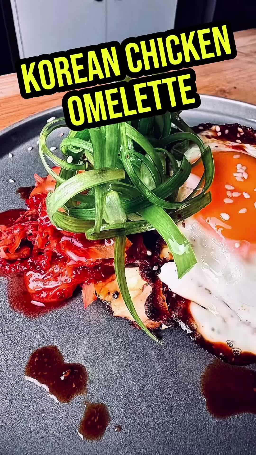 Right, I bet you’re sitting on your backside doing absolutely nothing, you’re starving, and you need some brekkie. So here’s my Gluten-Free Korean Chicken Omelette. It’s packed with flavour, it’s easy as hell to make, and even you can bloody cook this one. So get off your arse, give it a crack, and let’s make some breakfast.

Ingredients:
* 500g chicken thighs, sliced thinly 
* 3 tbsp gluten-free cornflour
* 1 tsp salt
* ½ tsp pepper
* 1 tbsp gluten-free gochujang 
* 2 tbsp oil
* 3 large eggs
* 1 cup gluten-free kimchi, chopped
* 2 spring onions, sliced (white part, keep green part for garnish)
* 1 tbsp minced garlic

Sauce:
* 1 tbsp gluten-free gochujang
* 1 tbsp minced garlic 
* 1 tbsp gluten-free light and dark soy sauce
* 1 tbsp rice vinegar 
* 1-2 tbsp honey
* 1 tsp sesame oil
* 1/2 tsp cracked black pepper 
* Drop of cold water

To Serve

* Fried eggs
* Sesame seeds
* Green part of spring onions
* Kimchi

Method:
1. Coat the chicken with the cornflour, salt, pepper, eggs, gochujang, and allow to marinate for 10 minutes.
2. Next, pop in the cabbage and white part of the spring onions.
3. Heat a large frying pan over a high heat with the oil.
4. Fry the chicken mixture until about 80% cooked and lightly golden.
5. Next, fold the omelette in half and cook until the chicken is cooked.
6. Meanwhile, mix the gochujang, soy sauces, honey, garlic, pepper, sesame oil, and water together.
7. Cut the omelette in half and check the chicken is cooked. Stack on top of each other on a plate and top with a fried egg, sesame seeds, kimchi, sauce and spring onions.

Tip: for making your spring onions curl, slice the green part thinly and pop into an ice bath.

#koreanbreakfast #Omelette #chicken #glutenfree topfans