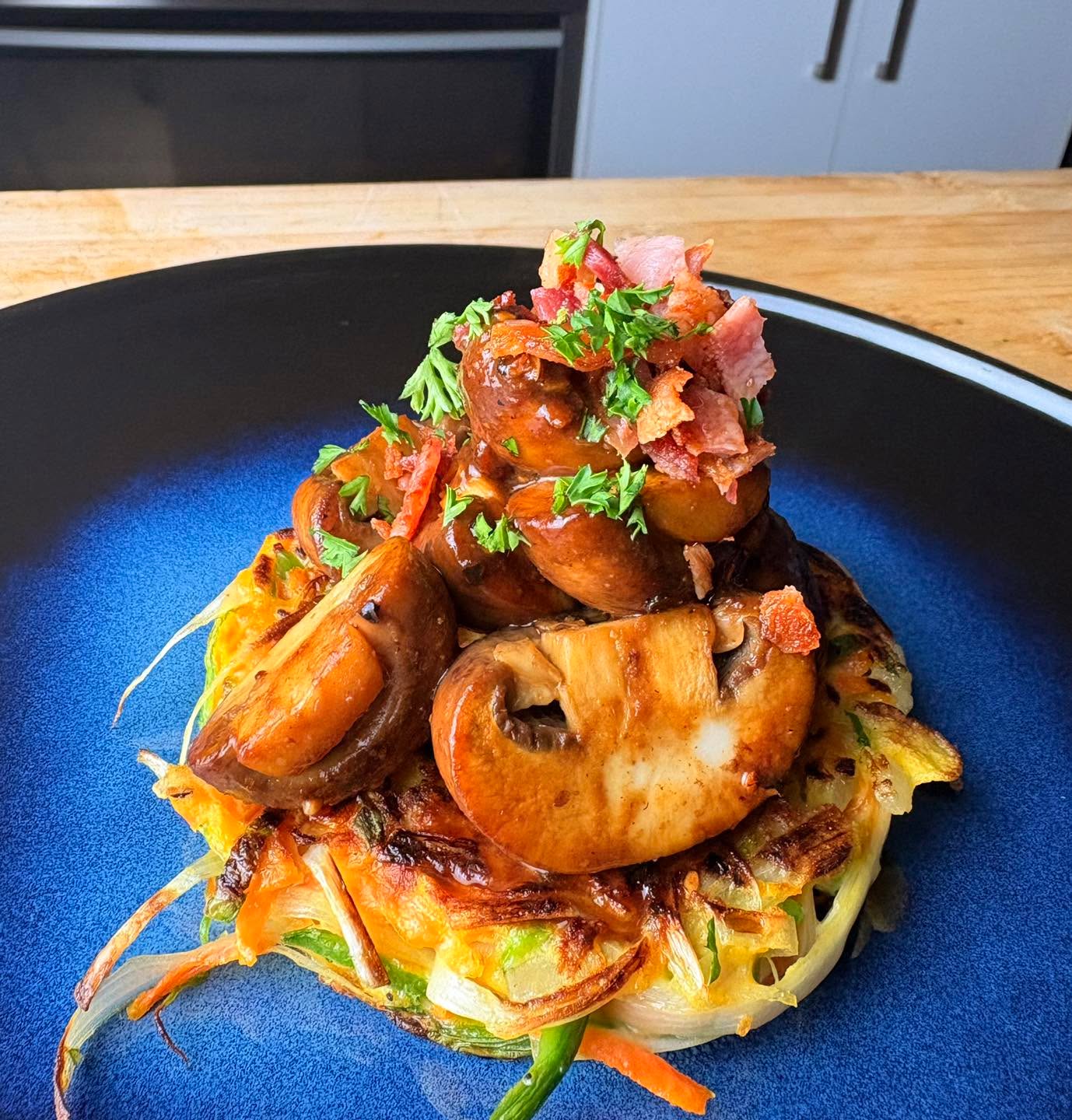 Lunch today - Veg Fritter with Miso Mushrooms, topped with Smoky Bacon.

#fritter #brunch